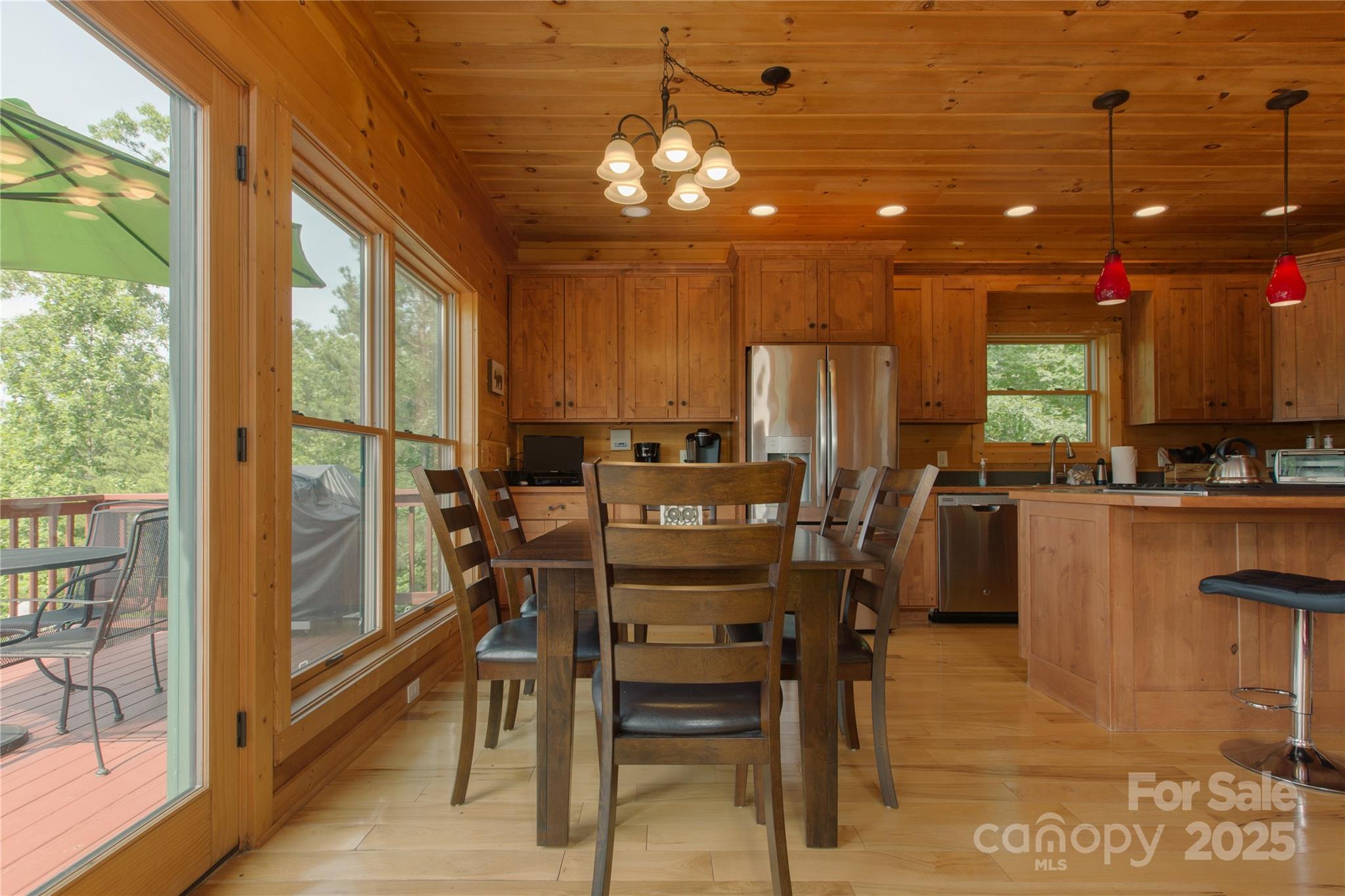 206 Legend Dr Mill Spring Mill Spring, NC 28756 - Photo 10 of 48 a view of a dining room with furniture and chandelier