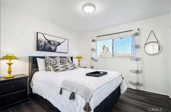 a bedroom with a bed and a table