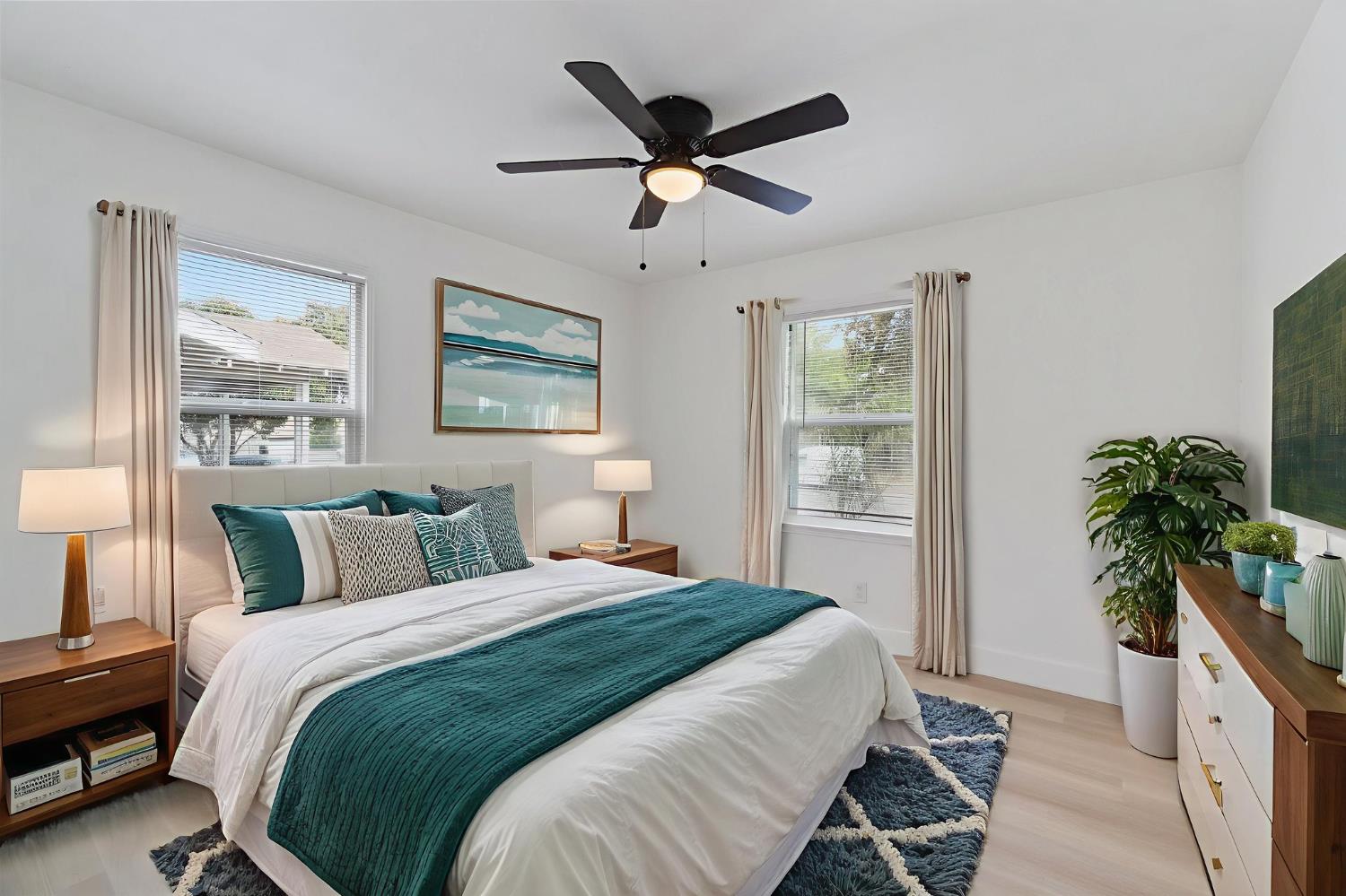 1559 North Carruth Avenue Fresno, CA 93728 - Photo 18 of 24 a bedroom with bed and a large window