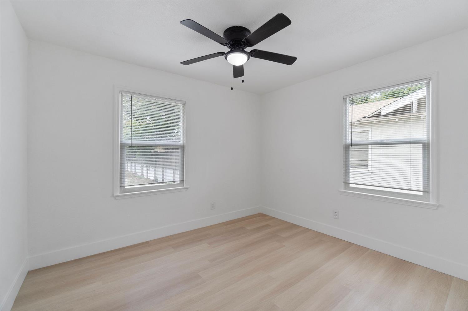 1559 North Carruth Avenue Fresno, CA 93728 - Photo 19 of 24 a view of empty room with wooden floor