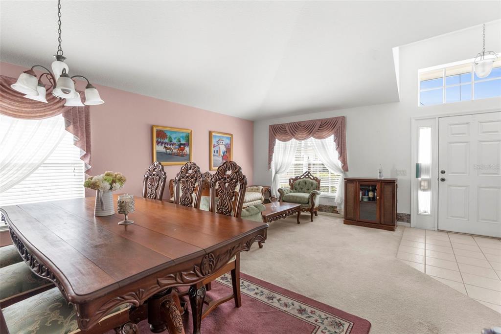 11847 Spindrift Loop Hudson, FL 34667 - Photo 6 of 28 a view of a dining room with furniture