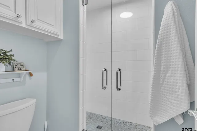 a bathroom with a shower curtain and a sink