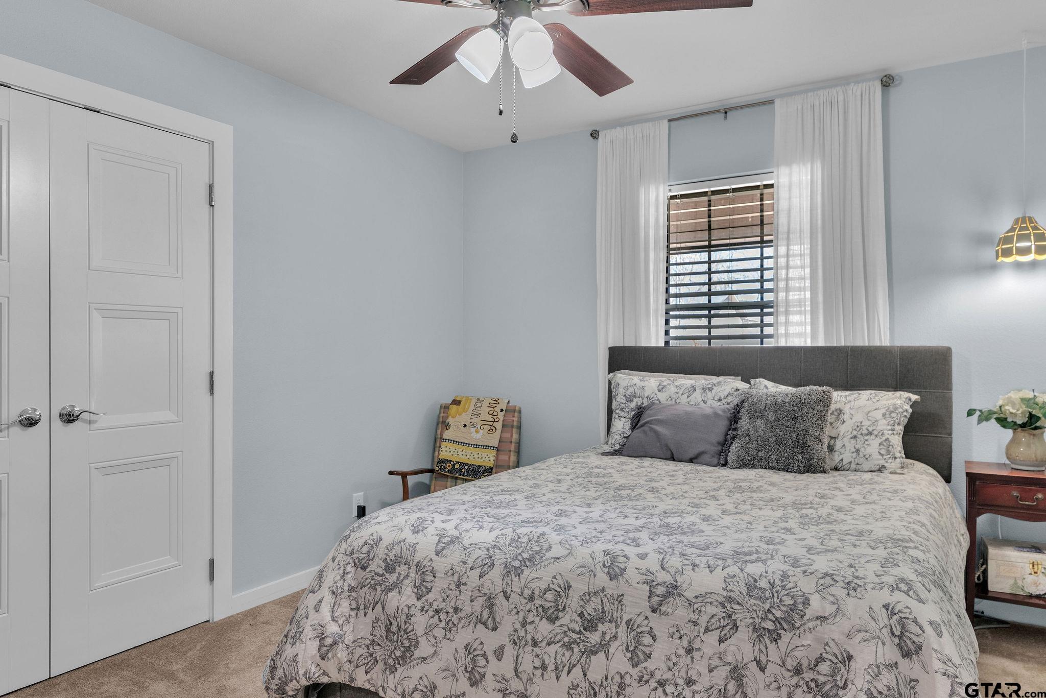 1208 Briarwood Lane Longview, TX 75604 - Photo 24 of 43 a bedroom with a bed and a window