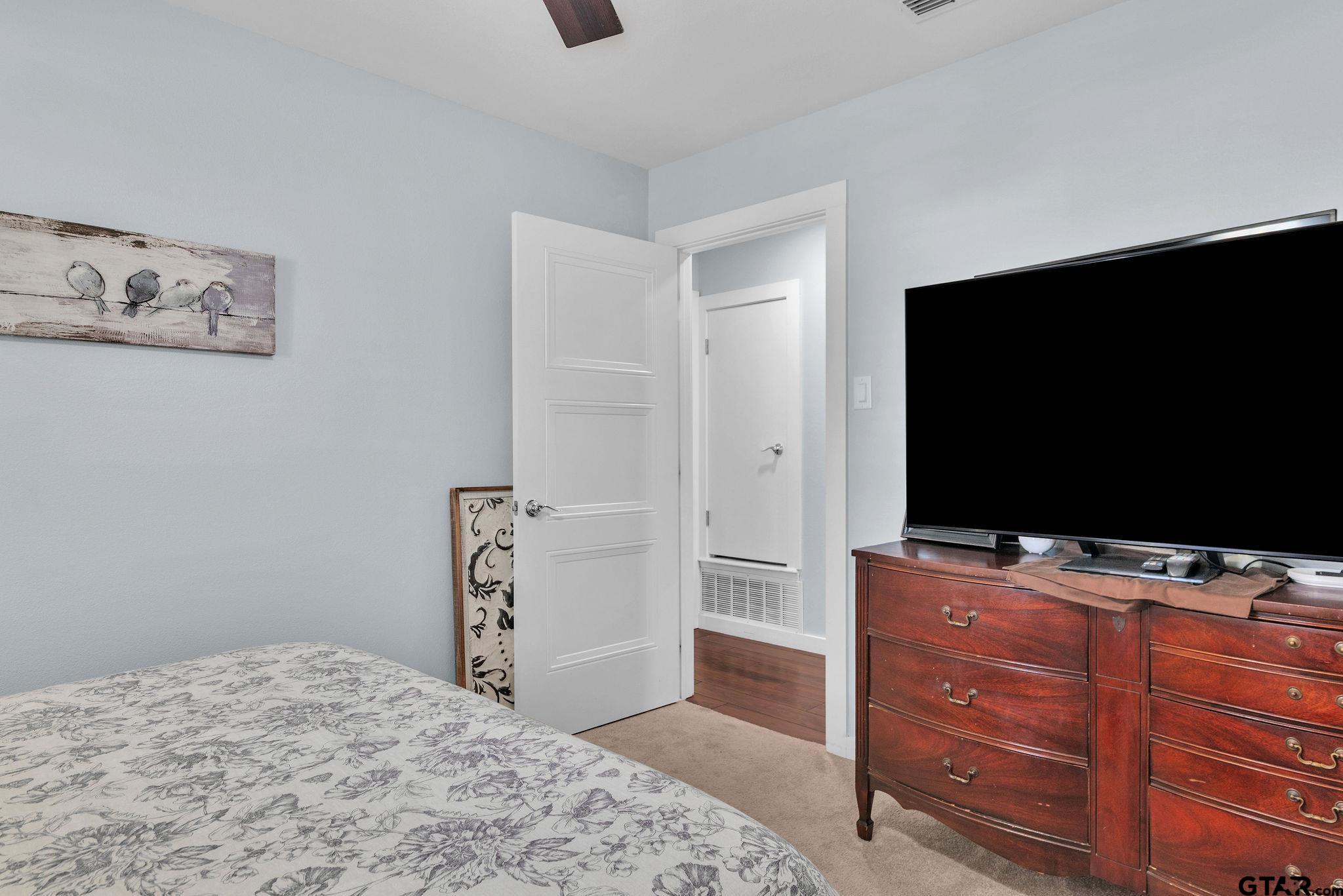 1208 Briarwood Lane Longview, TX 75604 - Photo 25 of 43 a bedroom with a bed and television