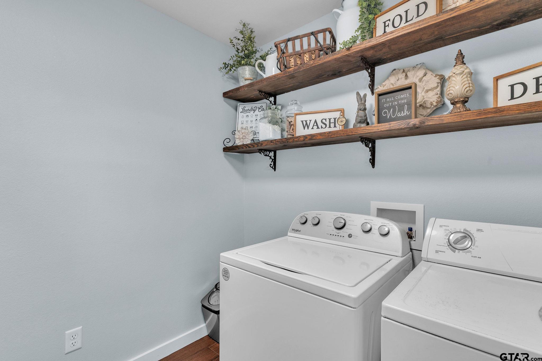 1208 Briarwood Lane Longview, TX 75604 - Photo 29 of 43 a utility room with dryer and washer