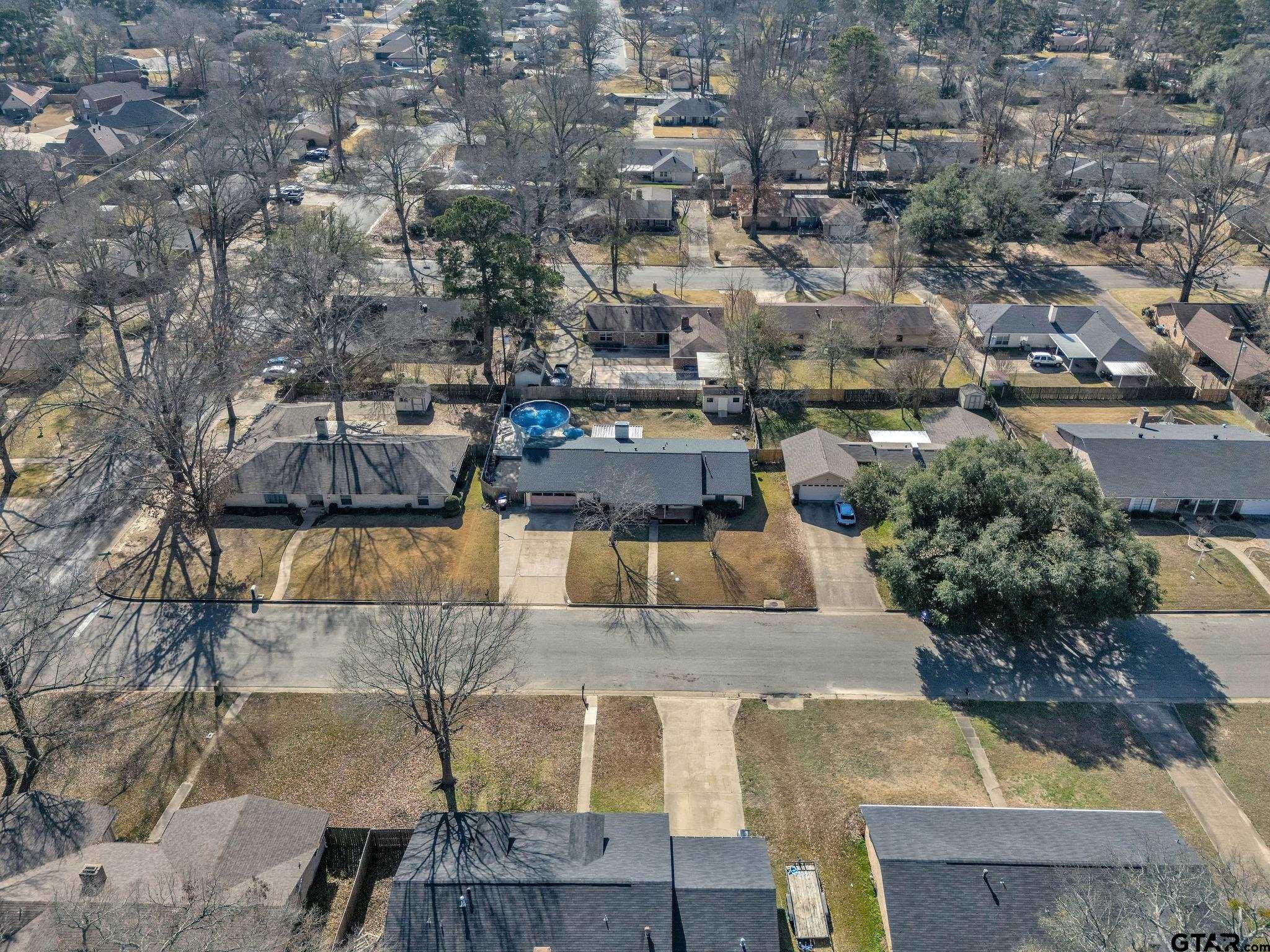 1208 Briarwood Lane Longview, TX 75604 - Photo 40 of 43 an aerial view of residential houses with outdoor space