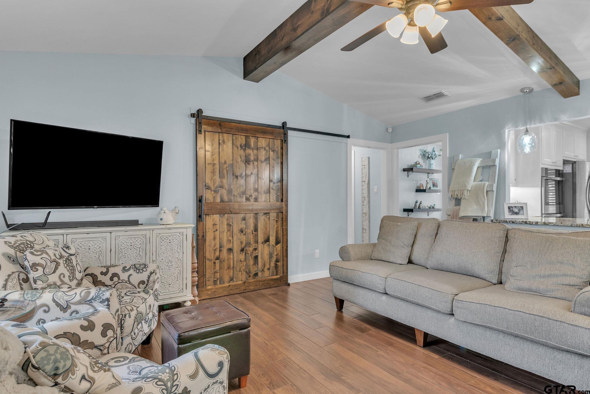 1208 Briarwood Lane Longview, TX 75604 - Photo 5 of 43 a living room with furniture and a flat screen tv
