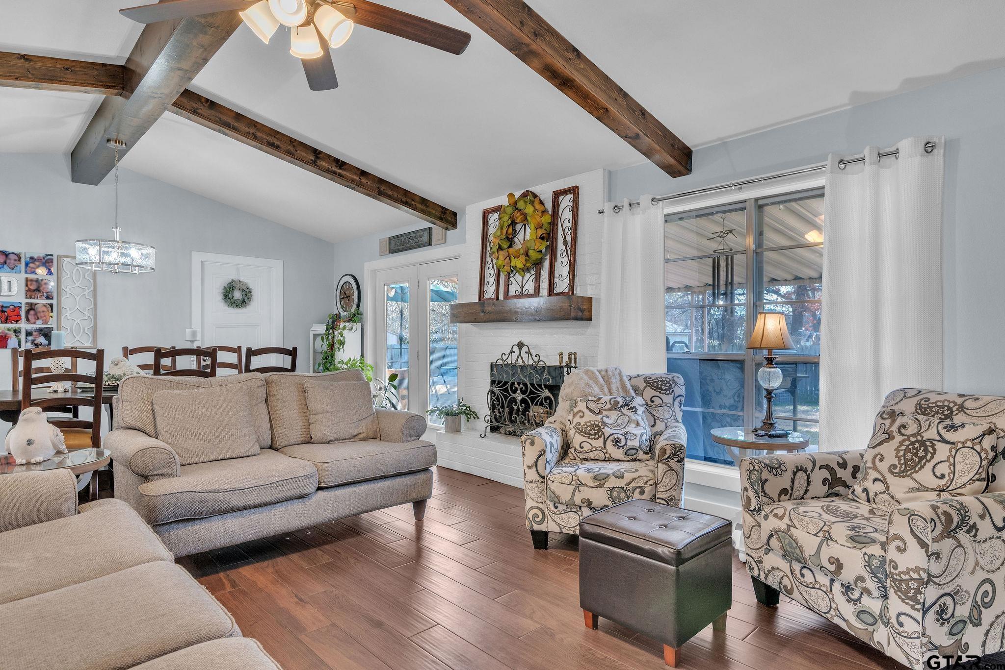 1208 Briarwood Lane Longview, TX 75604 - Photo 7 of 43 a living room with furniture and a large window
