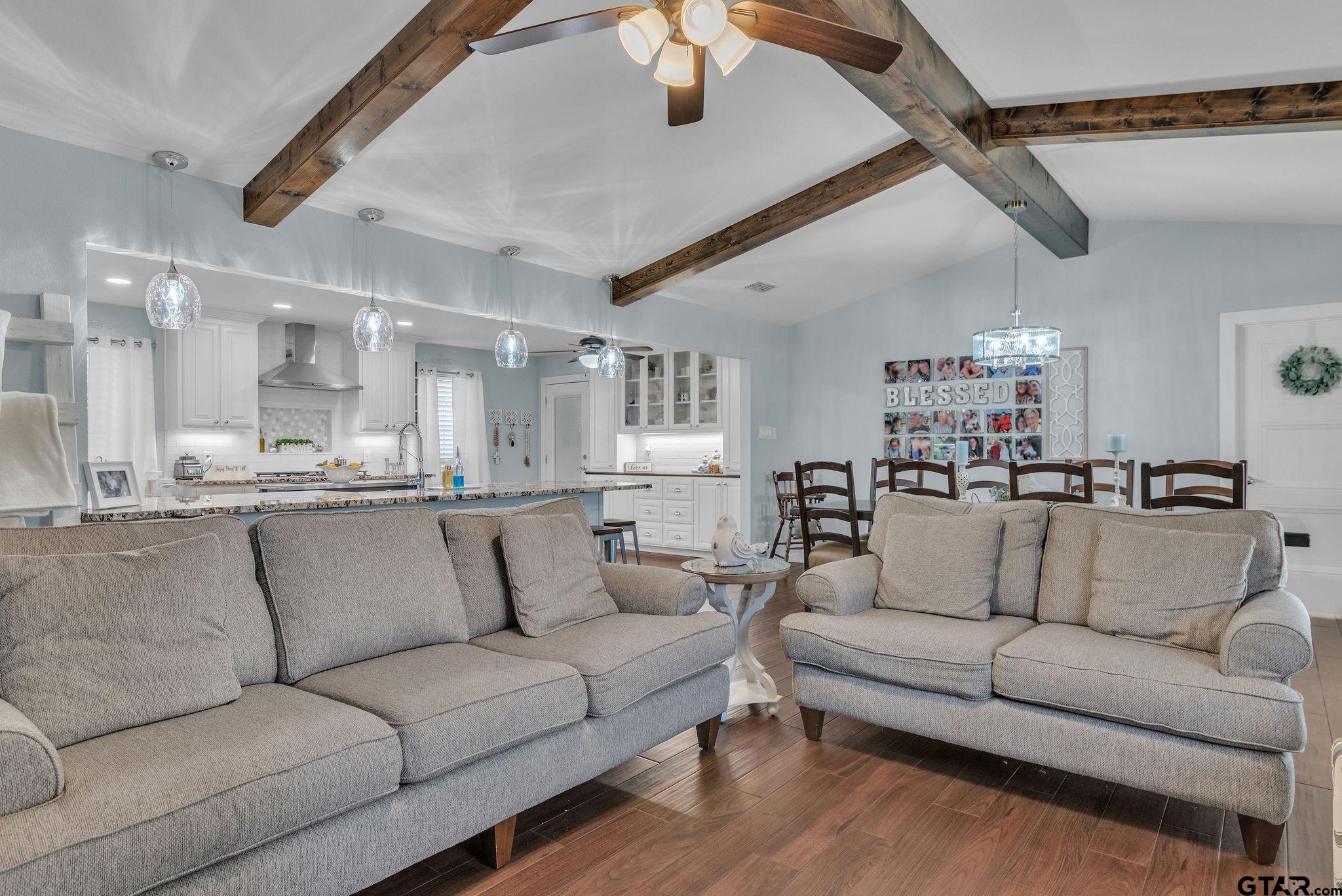 1208 Briarwood Lane Longview, TX 75604 - Photo 8 of 43 a view of a living room kitchen and a wooden floor