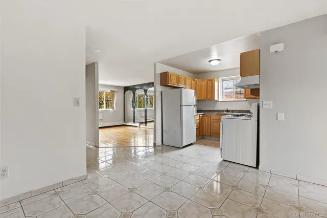 a bathroom with a sink toilet vanity and shower