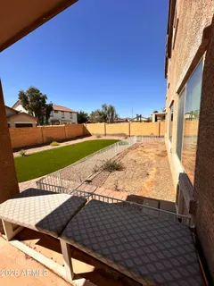 a view of a back yard of the house