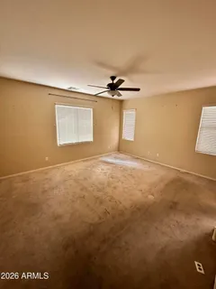 an empty room with a empty space and windows