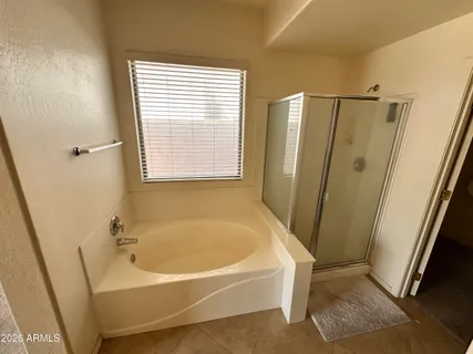 a white bath tub sitting next to a window