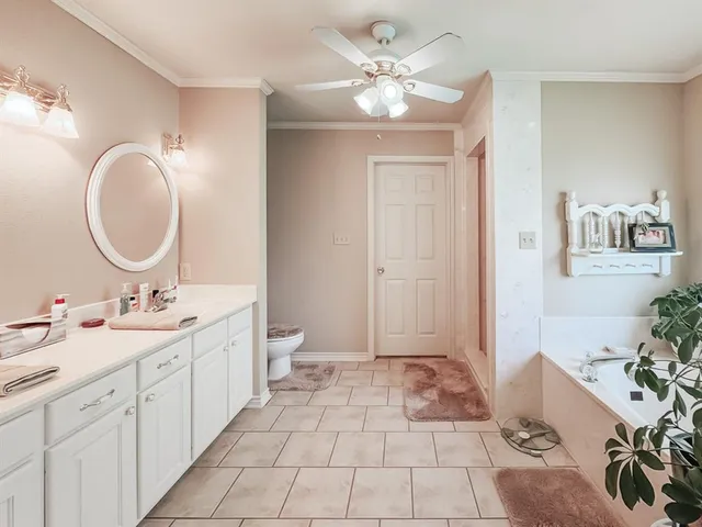 a bathroom with a double vanity sink mirror and