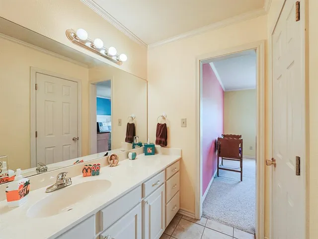 a bathroom with a double vanity sink mirror and