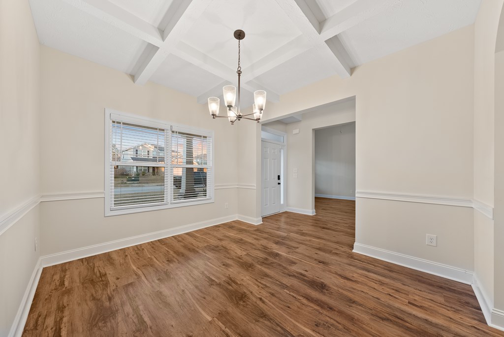 7312 Pine Chase Drive Midland, GA 31820 - Photo 17 of 51 a view of an empty room with wooden floor and a window