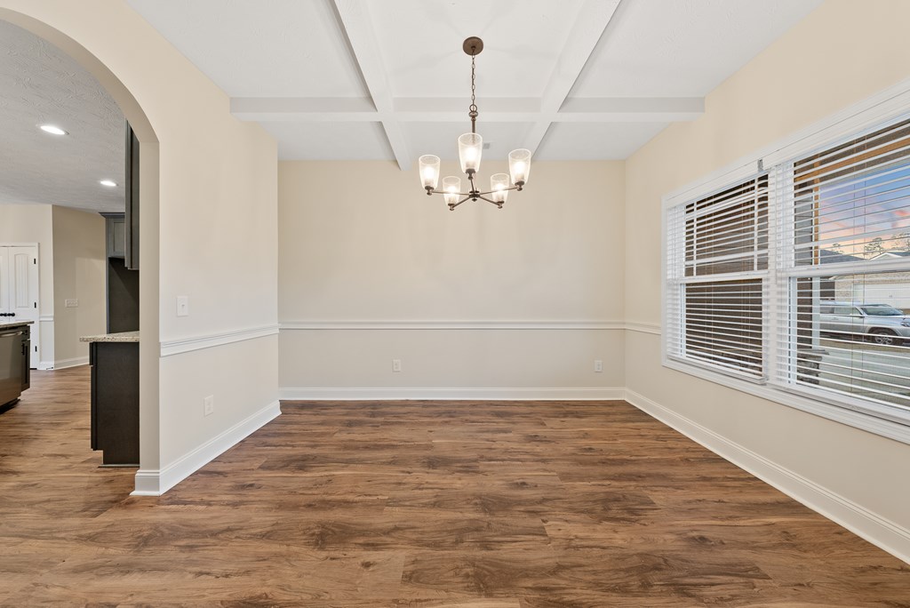 7312 Pine Chase Drive Midland, GA 31820 - Photo 18 of 51 an empty room with wooden floor and windows