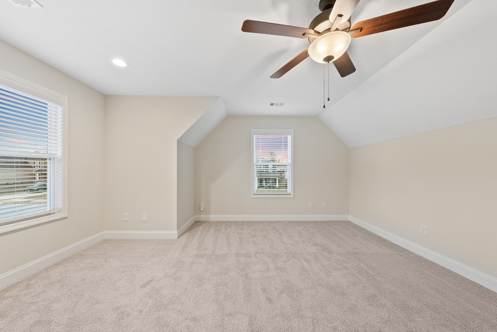 7312 Pine Chase Drive Midland, GA 31820 - Photo 26 of 51 an empty room with a window and ceiling fan