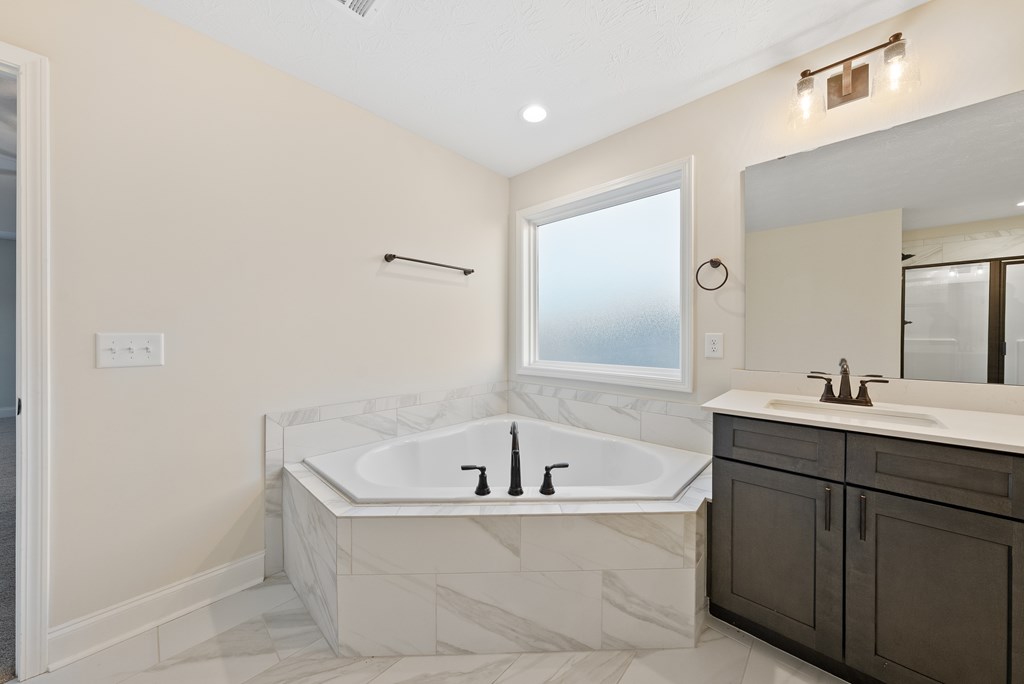 7312 Pine Chase Drive Midland, GA 31820 - Photo 28 of 51 a white bath tub sitting in a bathroom