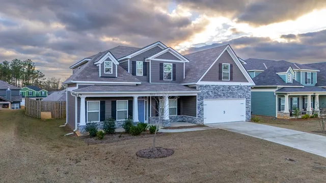 a front view of a house with yard