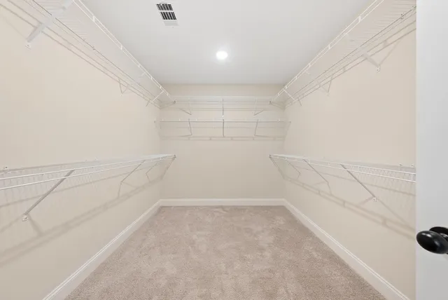 a white bath tub sitting next to a white toilet and sink