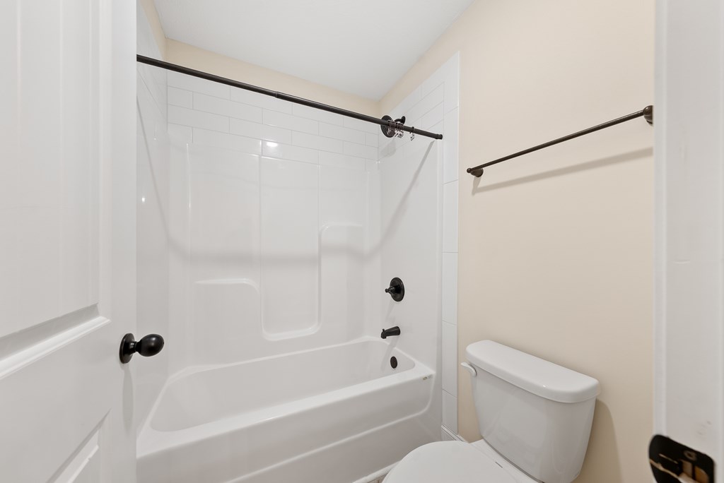 7312 Pine Chase Drive Midland, GA 31820 - Photo 33 of 51 a white bath tub sitting next to a white toilet and sink