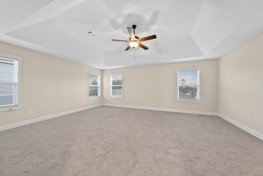 7312 Pine Chase Drive Midland, GA 31820 - Photo 35 of 51 an empty room with windows and fan