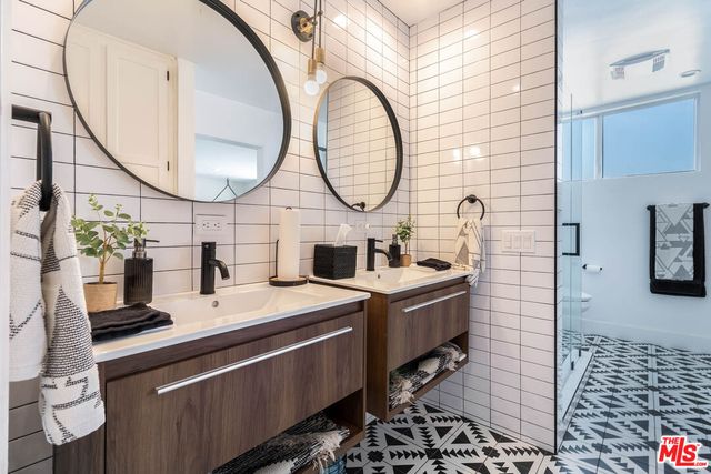 a room with a sink and a mirror