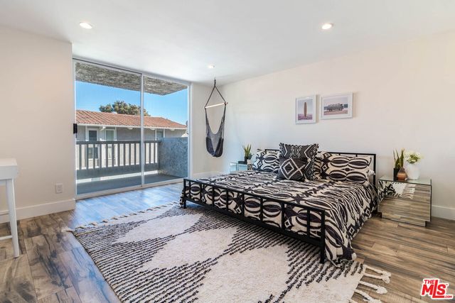 a bed room with a bed and a window