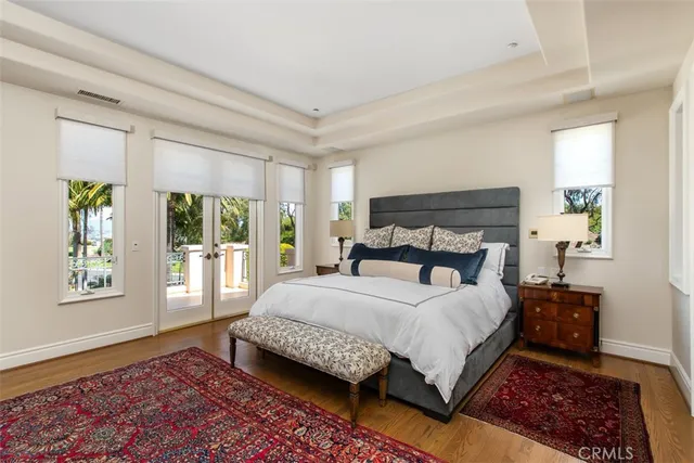 a view of a swimming pool with chairs in patio