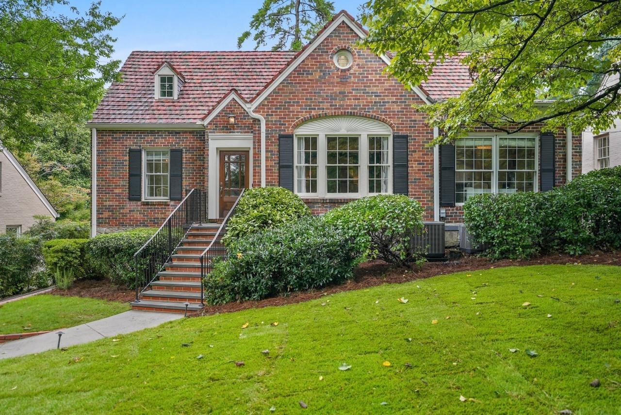526 East Wesley Road Northeast Atlanta, GA 30305 - Photo 1 of 1 a front view of a house with a yard
