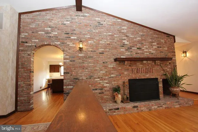 a living room with a fireplace furniture and a fireplace