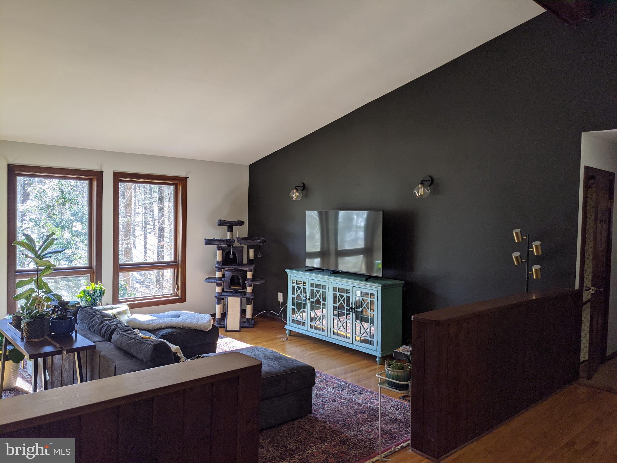 10264 Greystone Road Manassas, VA 20111 - Photo 2 of 23 a living room with furniture and a flat screen tv