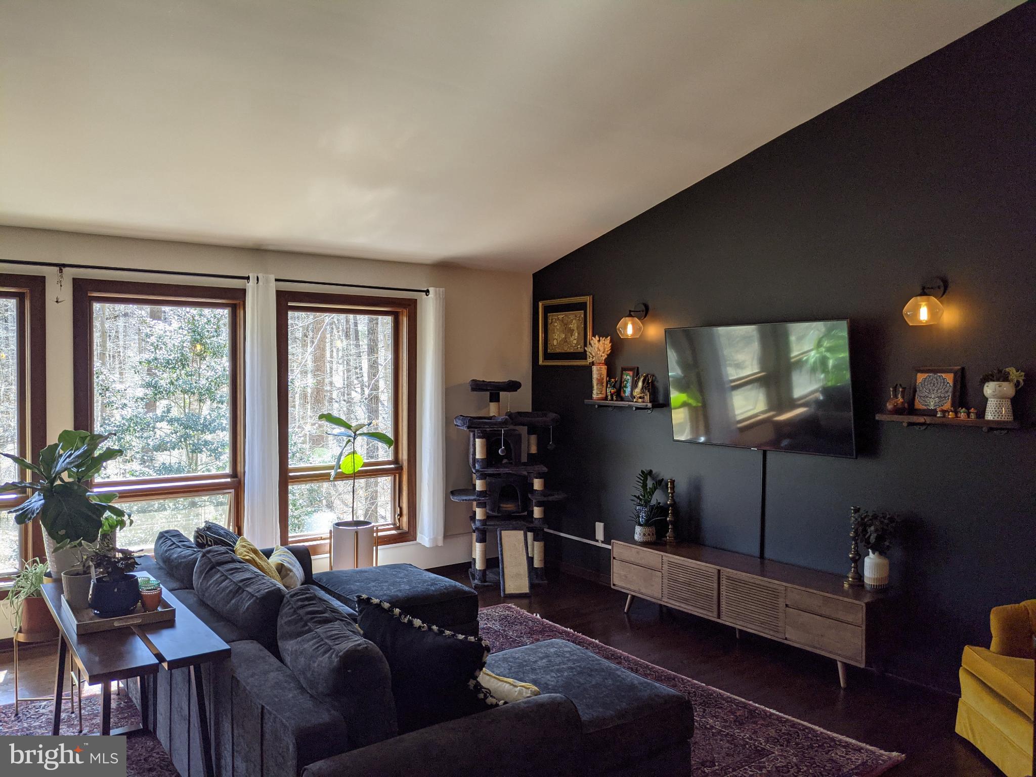 10264 Greystone Road Manassas, VA 20111 - Photo 3 of 23 a living room with furniture and a flat screen tv
