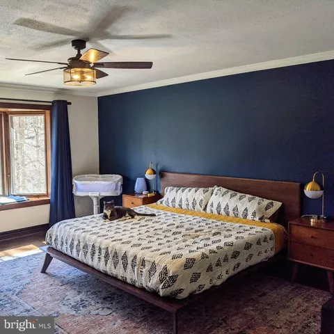 a bedroom with a bed and window