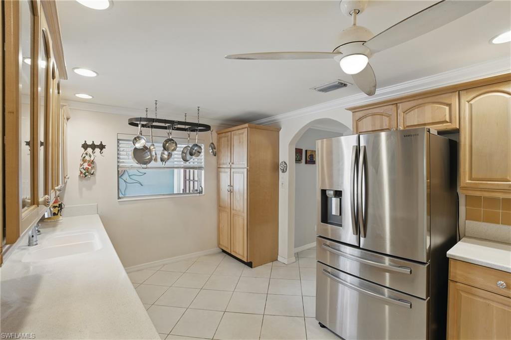 261 Viking Way Naples, FL 34110 - Photo 15 of 40 a kitchen with stainless steel appliances granite countertop a refrigerator and a refrigerator