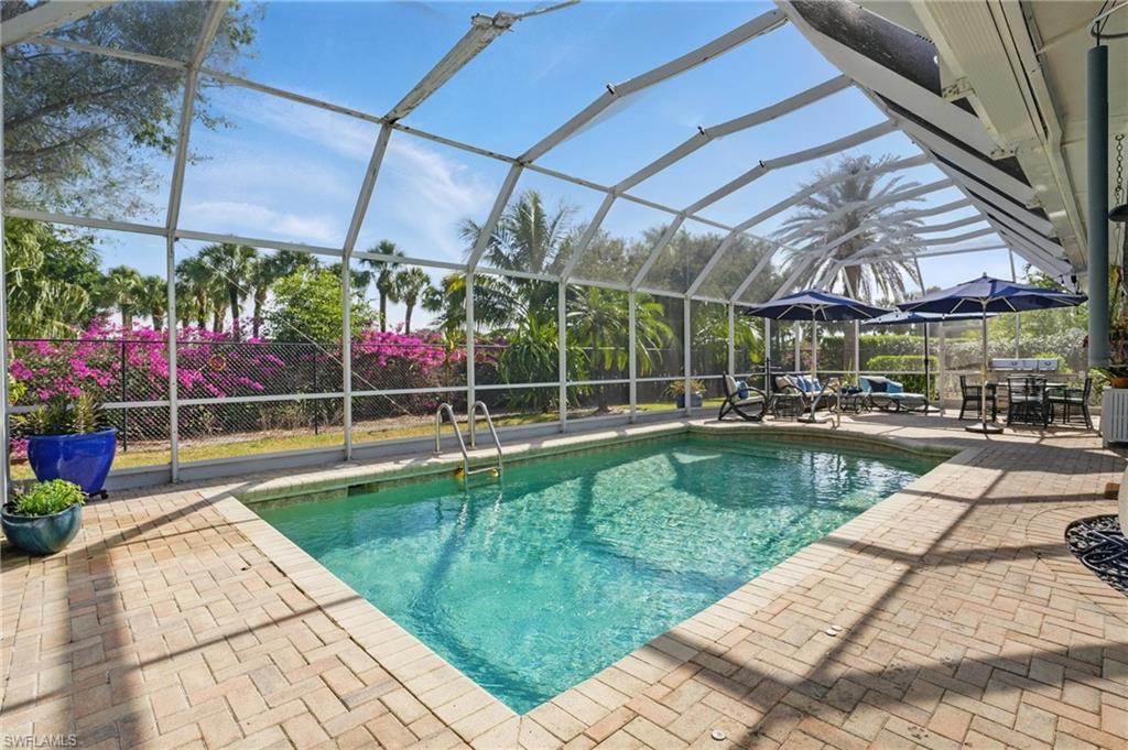 261 Viking Way Naples, FL 34110 - Photo 2 of 40 a view of a backyard with sitting area