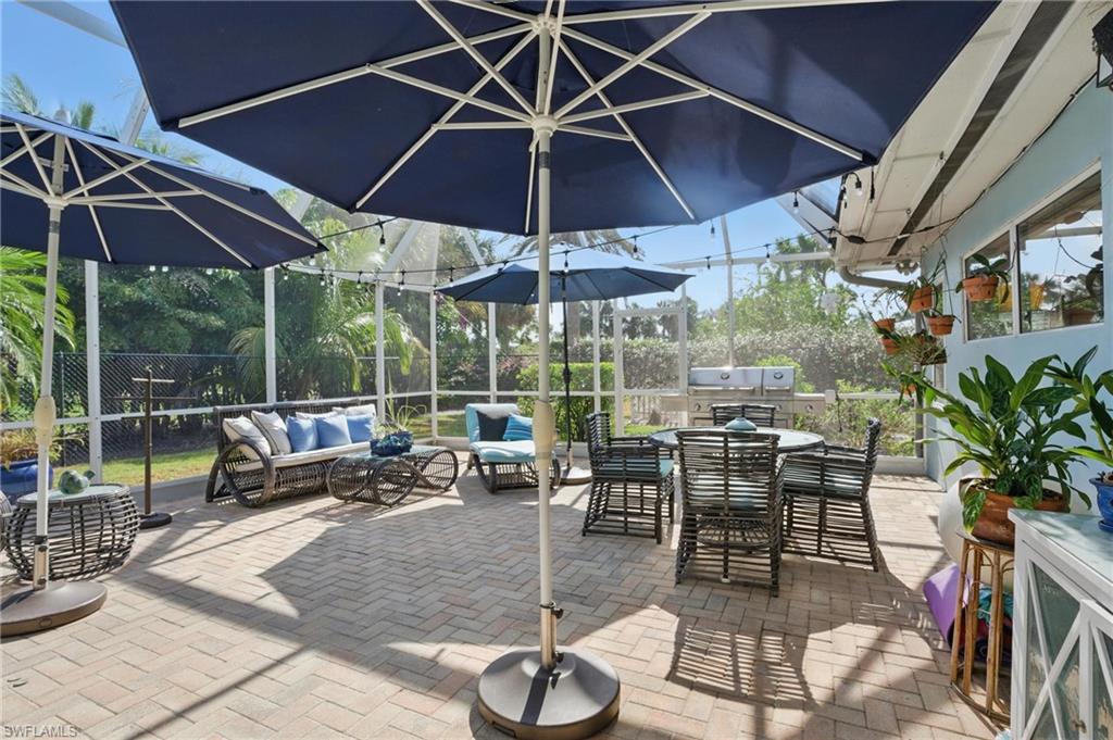 261 Viking Way Naples, FL 34110 - Photo 31 of 40 a view of a backyard with sitting area and furniture