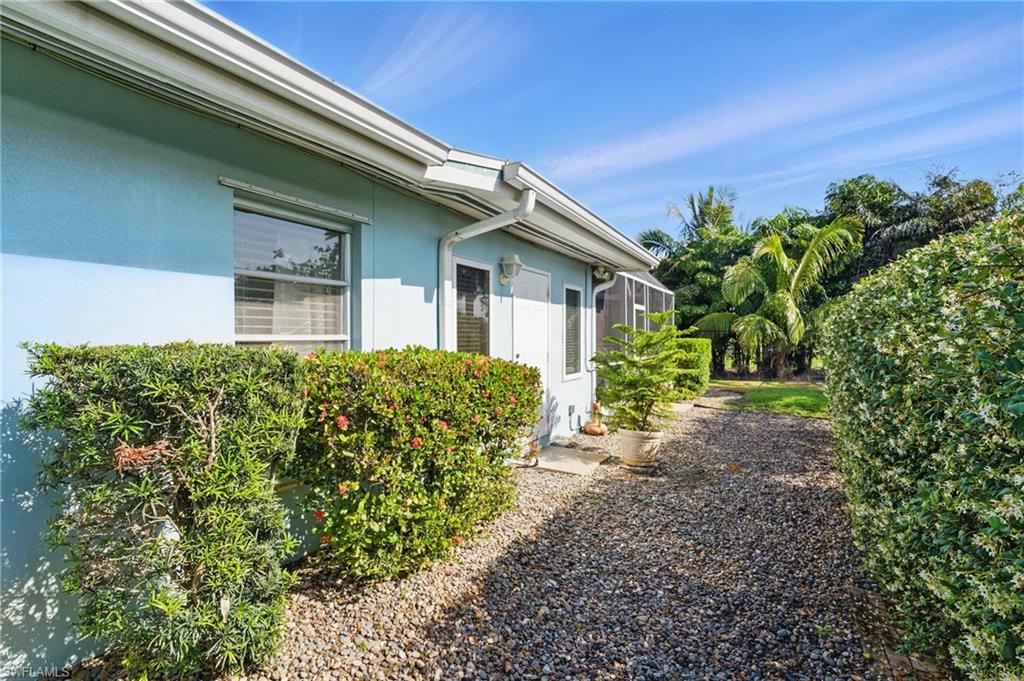 261 Viking Way Naples, FL 34110 - Photo 34 of 40 a view of a house with a garden
