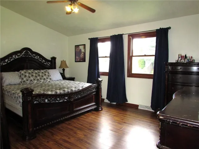 a bedroom with a bed and window