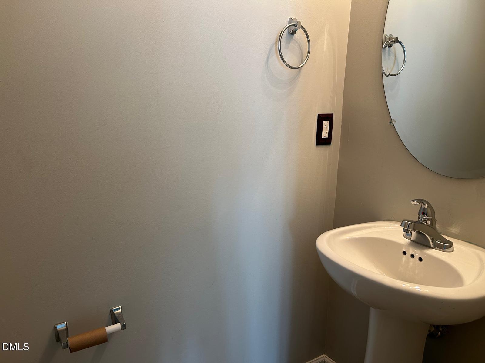 1524 Ricochet Drive Raleigh, NC 27610 - Photo 11 of 17 a bathroom with a sink and mirror