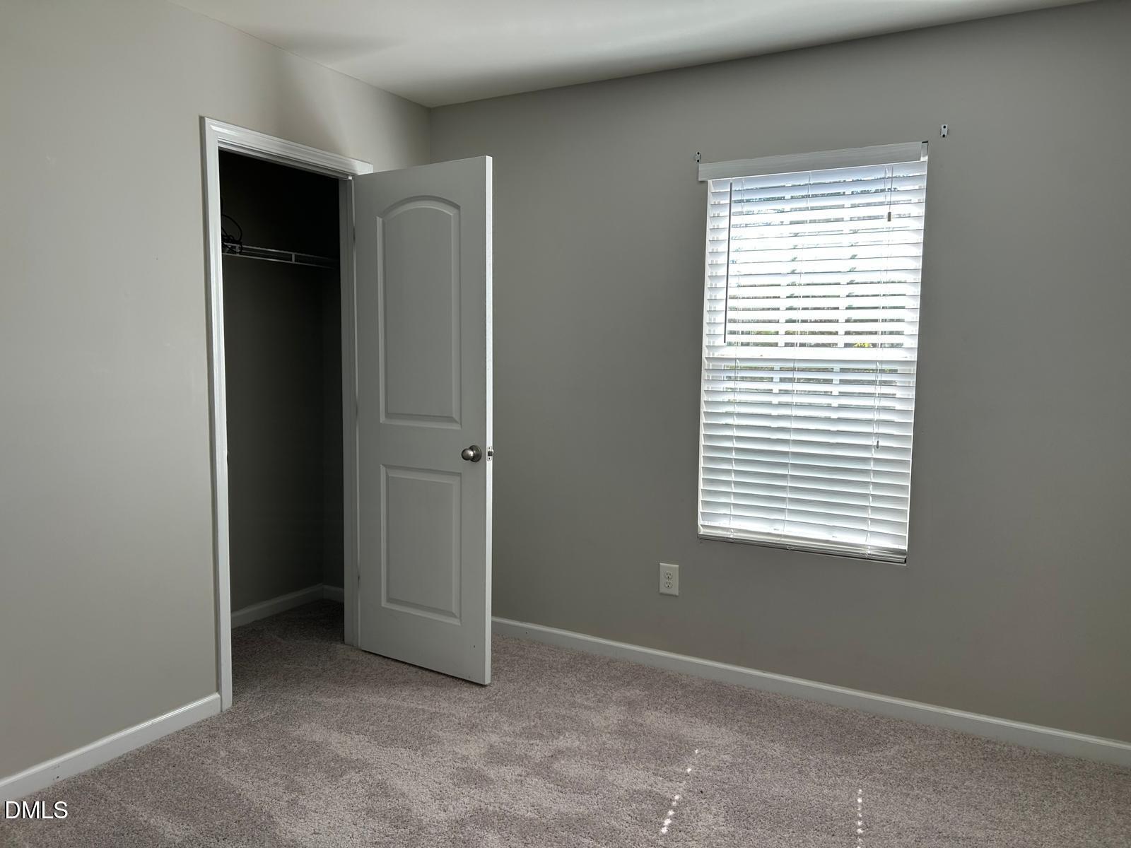 1524 Ricochet Drive Raleigh, NC 27610 - Photo 14 of 17 a view of an empty room with closet and a window