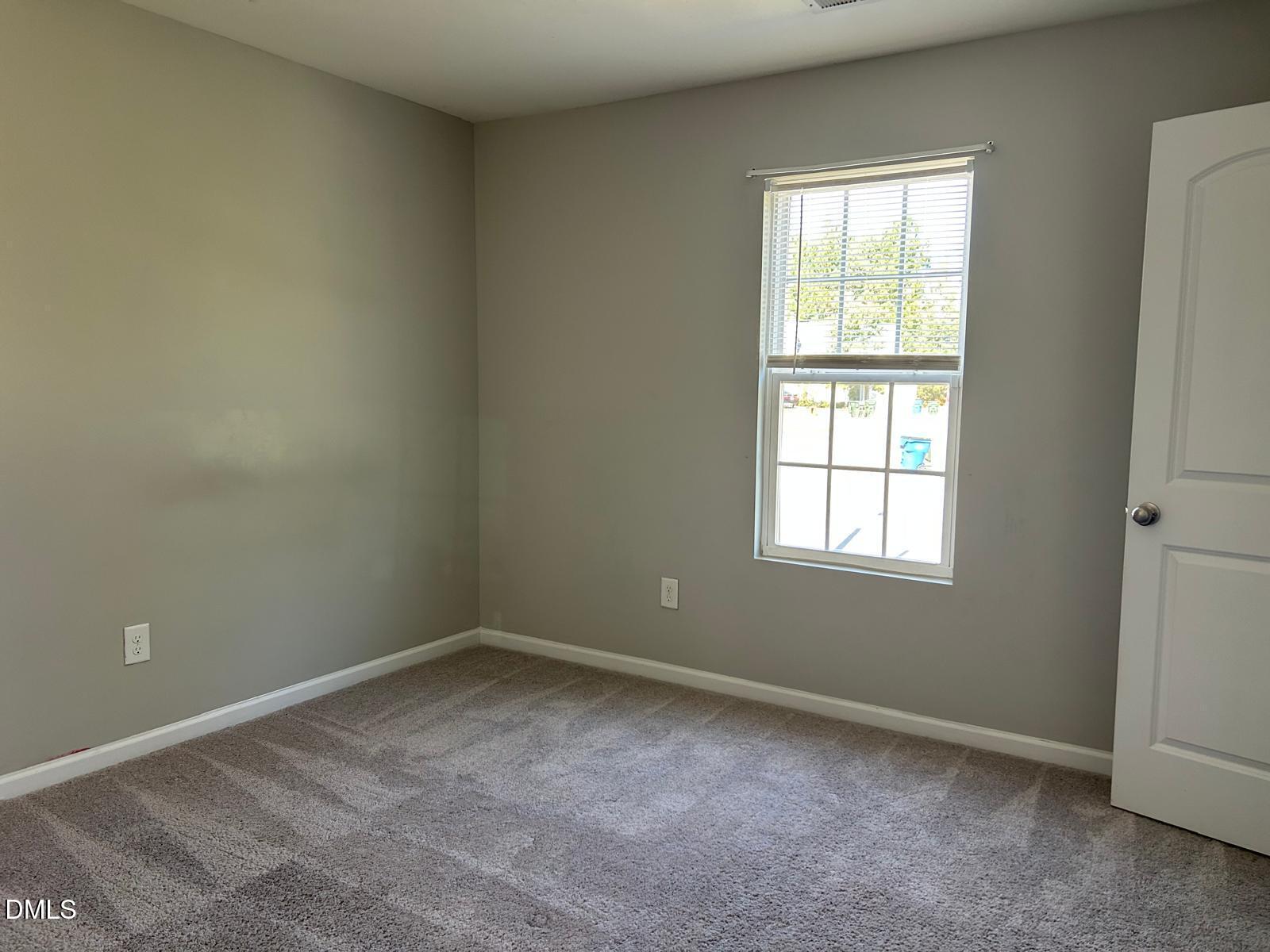 1524 Ricochet Drive Raleigh, NC 27610 - Photo 15 of 17 an empty room with a window