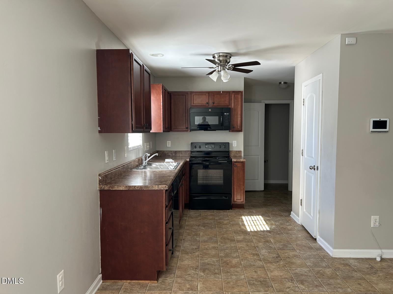 1524 Ricochet Drive Raleigh, NC 27610 - Photo 2 of 17 a kitchen with stainless steel appliances granite countertop a stove a sink and a refrigerator