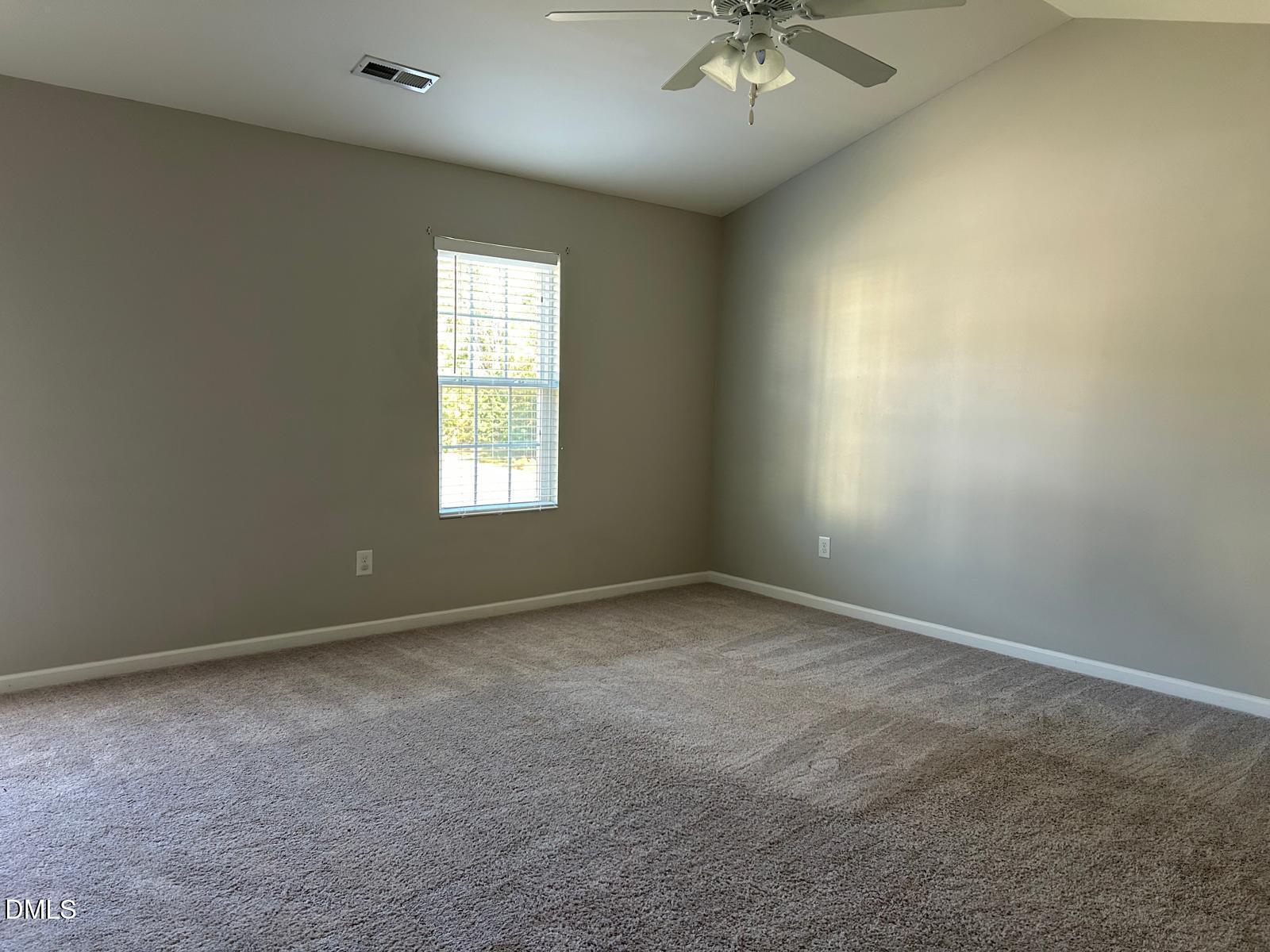 1524 Ricochet Drive Raleigh, NC 27610 - Photo 6 of 17 an empty room with a window