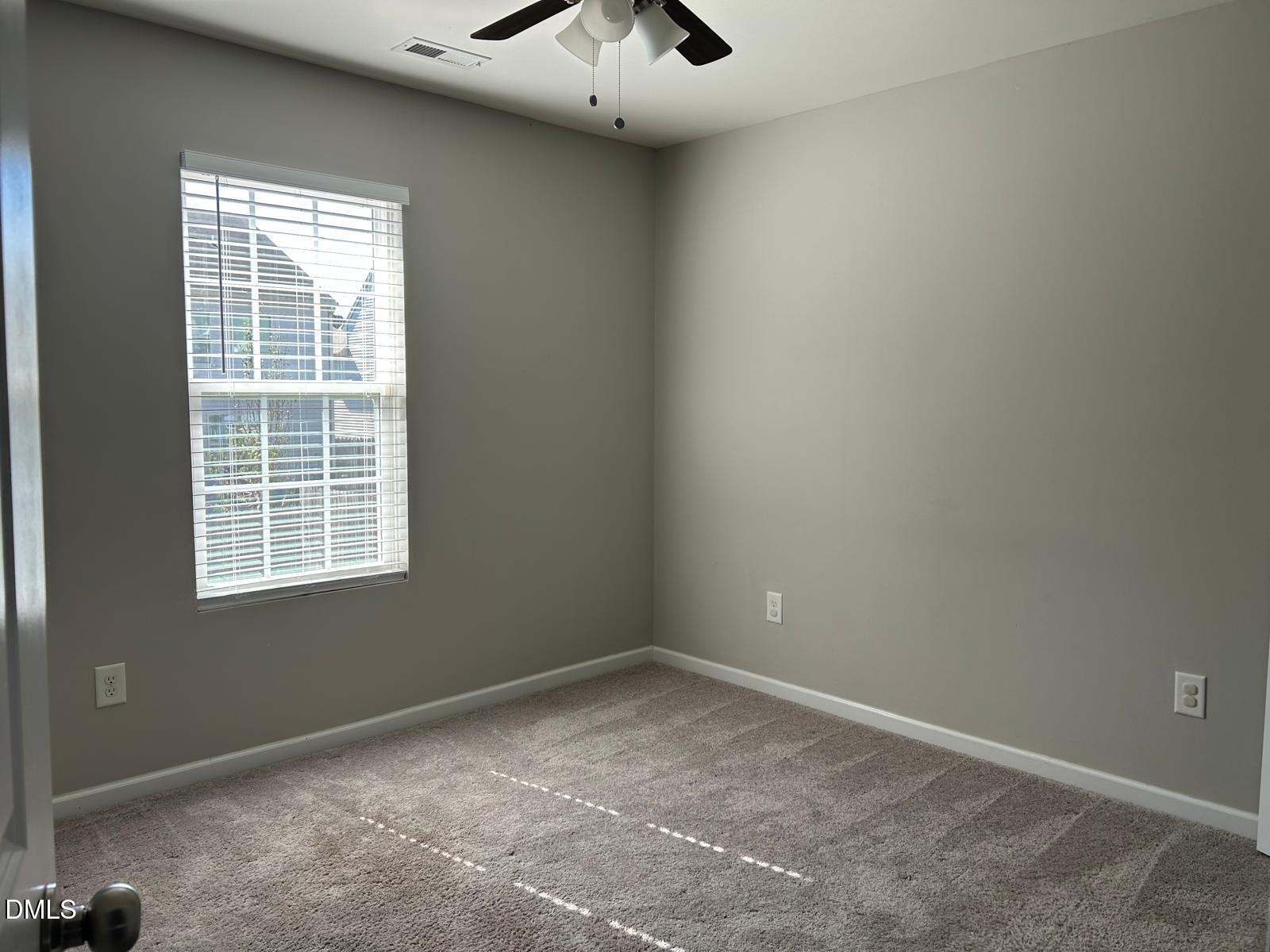 1524 Ricochet Drive Raleigh, NC 27610 - Photo 7 of 17 an empty room with a window