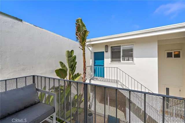 a view of livingroom with furniture a fireplace and wooden floor
