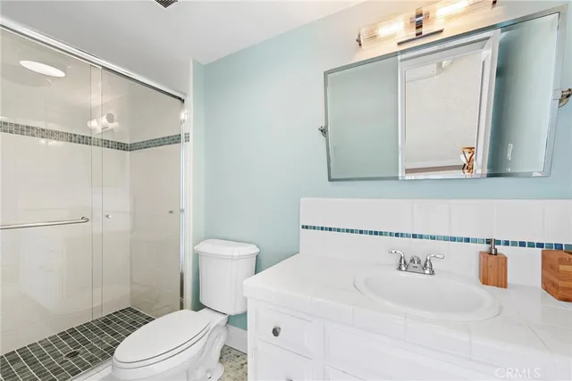 a bathroom with a double vanity sink and mirror