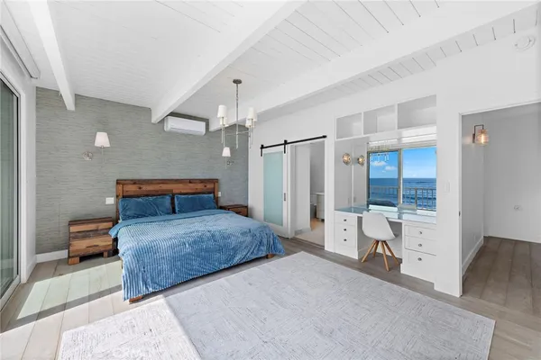 a view of a floor to ceiling window and wooden floor