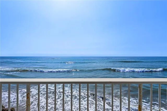 a view of a kitchen with sink and cabinets